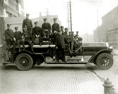 Detroit Fireman On a Firetruck  C. 1919
